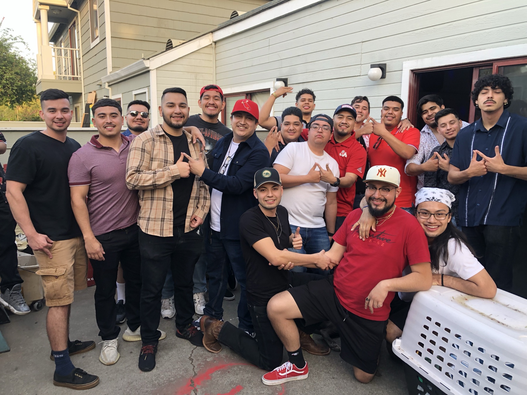 Brothers throwing the NAK sign