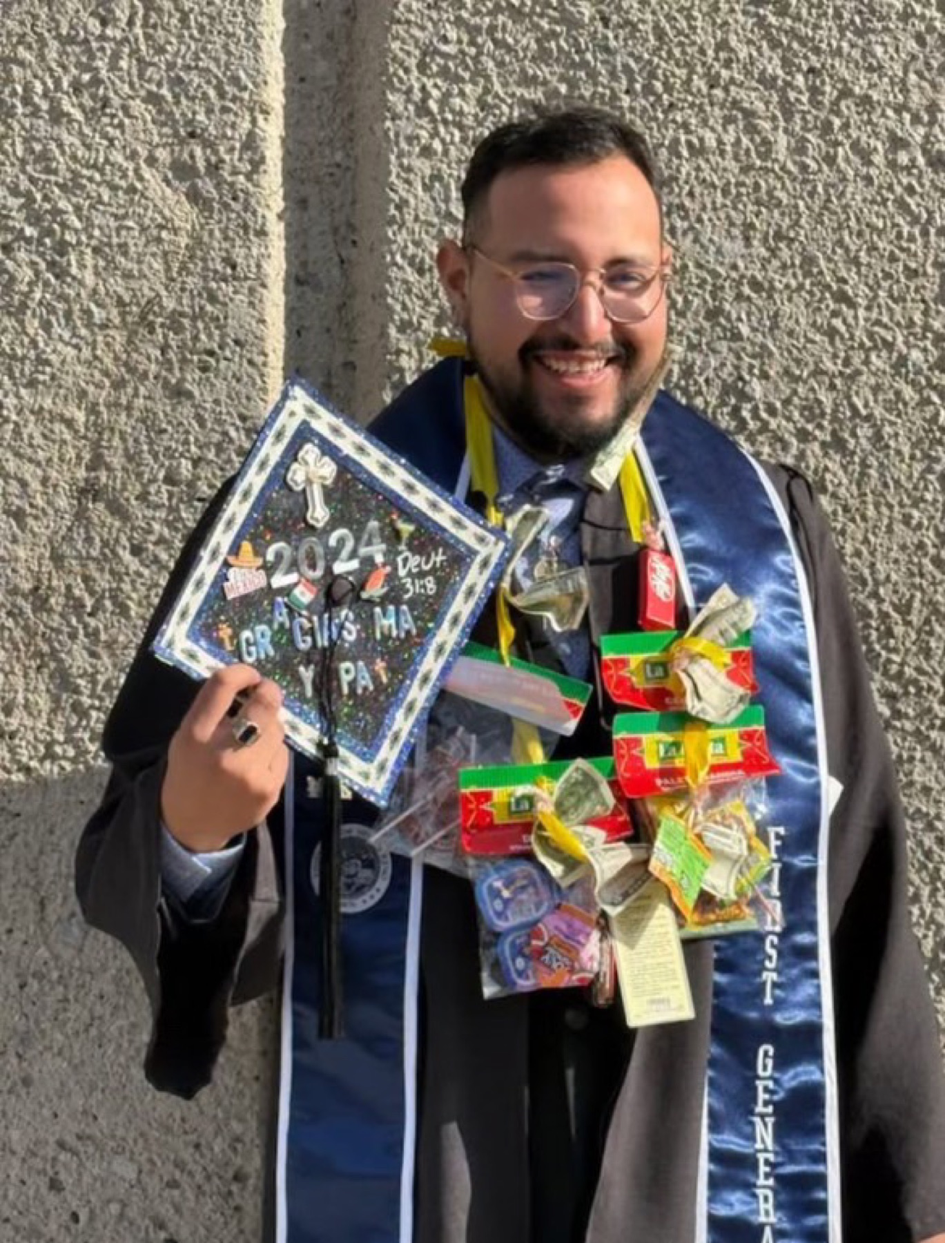Brother celebrating at graduation with a decorated cap
